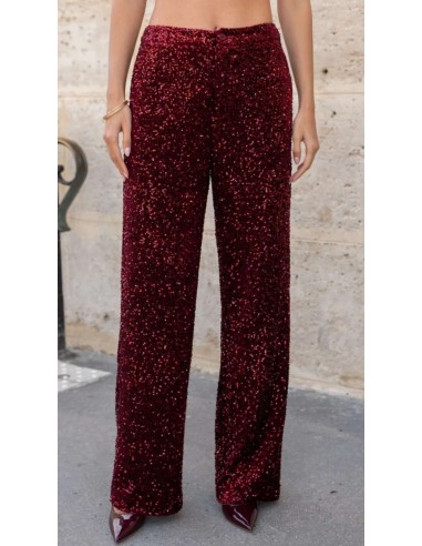 Traje de chaqueta en lentejuelas compuesto por chaqueta entallada y boton metalizado combinado con pantalón palazzo y bolsillos