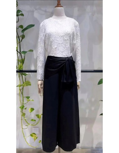 Pantalón corte cropped en tejido fluido con detalle de lazada en cintura satinada.