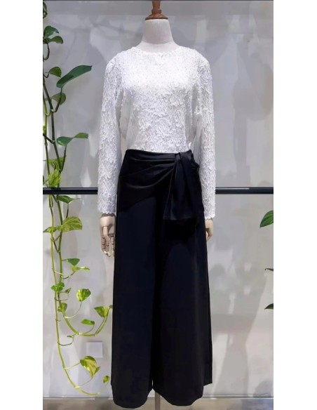 Pantalón corte cropped en tejido fluido con detalle de lazada en cintura satinada.