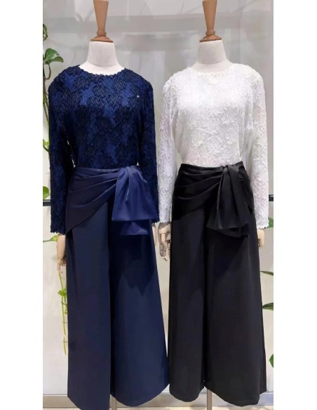 Pantalón corte cropped en tejido fluido con detalle de lazada en cintura satinada.