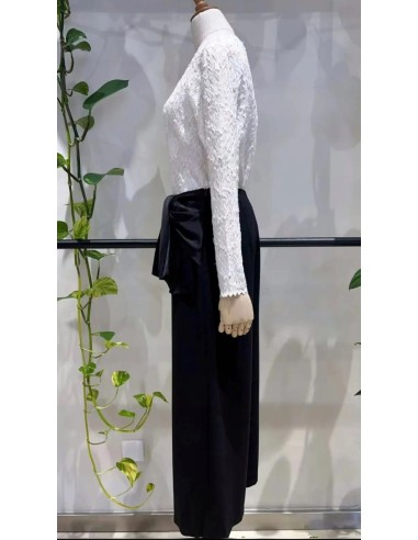 Pantalón corte cropped en tejido fluido con detalle de lazada en cintura satinada.