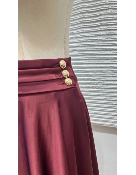 Falda de vuelo satinada con botones cinturilla y bosillos. Última tendencia al mejor precio.