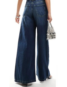 Jeans de tiro alto palazzo en tejido azul oscuro y cinco bolsillos. Tejido elástico.